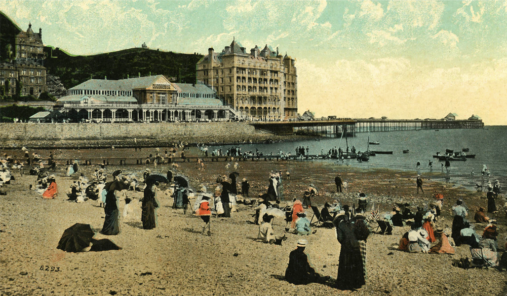 Victorian holiday goers show their seaside fashion.